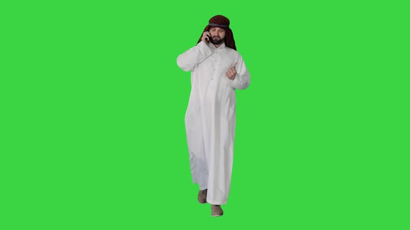 Arab Sheikh Making a Call Walking on a Green Screen, Chroma Key