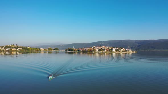 Fishing boat on lake at sunset golyazi, bursa turkey
