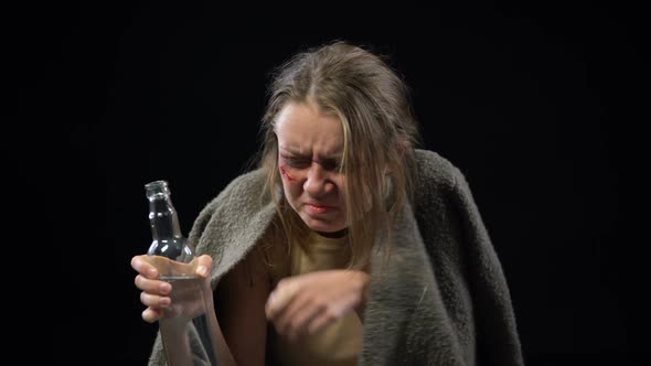 Desperate Woman With Wounded Face Drinking Vodka, Trying to Forget Herself, Pain