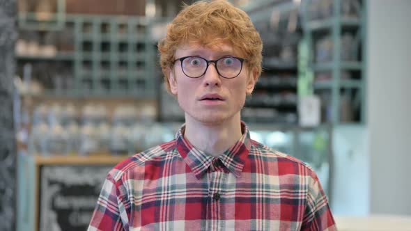 Worried Young Redhead Man Feeling Shocked