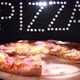 Delicious  Fresh Italian Pizza On A Black Background With The Effect Of Light Inscription Pizza - VideoHive Item for Sale