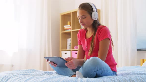 Girl Having Vide Call on Tablet Computer at Home