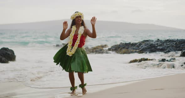 Woman performing Hawaiian hula on the beach