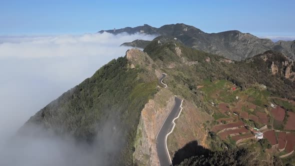 Flight Over Clouds and Mountain Road in Anaga, Tenerife