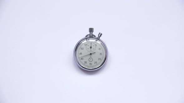 Clock in the Accelerated Shooting With a White Background