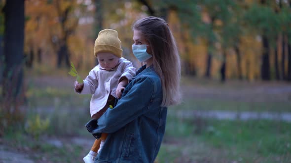 Masked Mother Holds Hand Lovely Daughter on Street Walk During Second Wave Quarantine Coronavirus