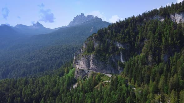 Aerial View of an Asphalt Road in the Dolomites Mountains in Italy