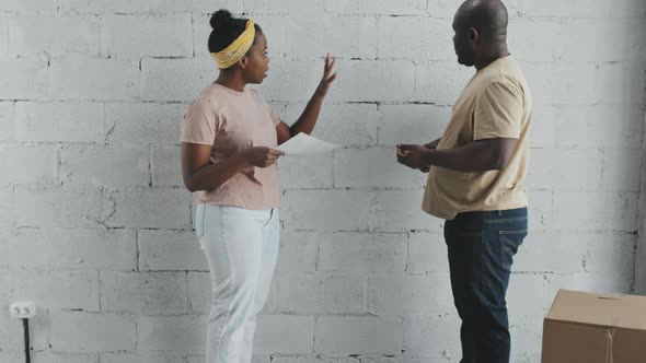 African-American Woman and Man Remodeling House