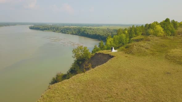 Just Married Couple Enjoys River View From Steep Bank Aerial