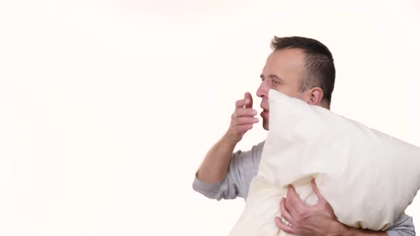 Man Sleepy with Pillow Yawning 