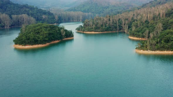 Drone fly over the lake and forest