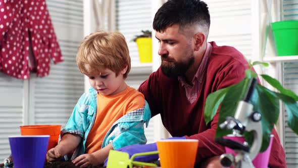 Father and Son Plantig Plant in Pots, Farmer Family