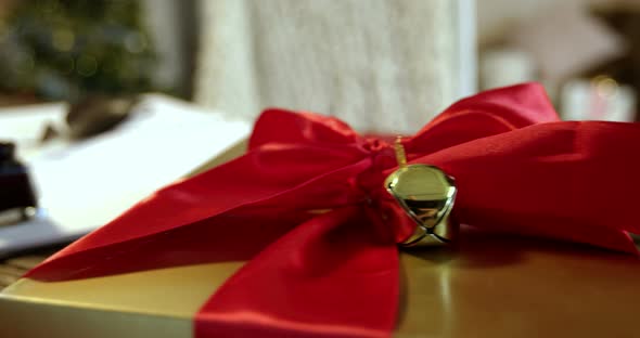 Close-up of gift box, diary, ink bottle and quill