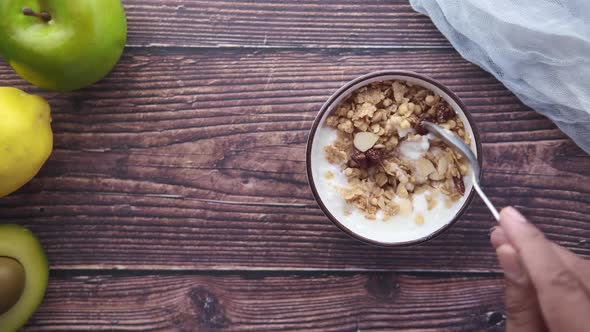 Yogurt Cereal Breakfast in Bowl on Wooden Background