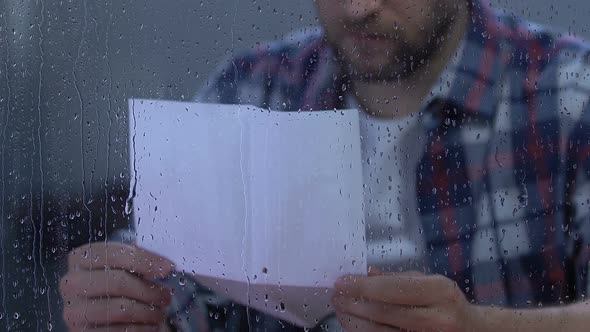 Desperate Male Reading Letter, Military Veteran Remembering Friends, Depression