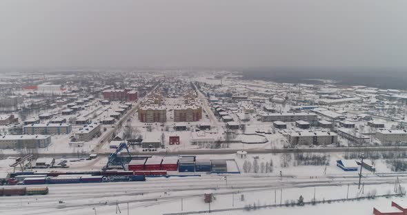 Sovetskiy city. Railway station and the trains.  Aerial. Winter, snow 01