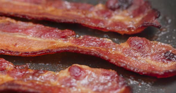 Cook with bacon on fry pan 