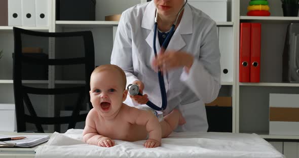 Child Rejoices During Examination By Doctor
