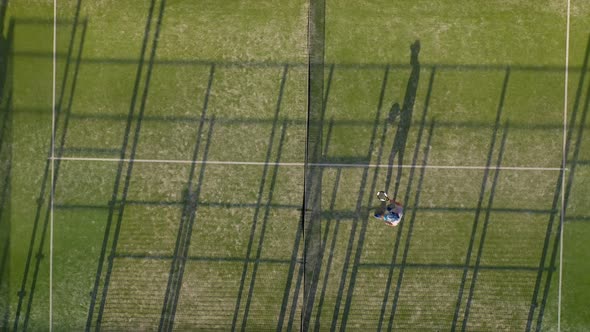 View From the Height of the Tennis Court Where People Play in the Tennis