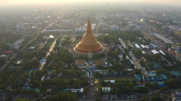 Aerial top view of Phra Pathommachedi temple at sunset in Nakorn Pathom district, Thailand.