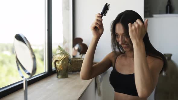 Woman at the Room in Front of a Mirror