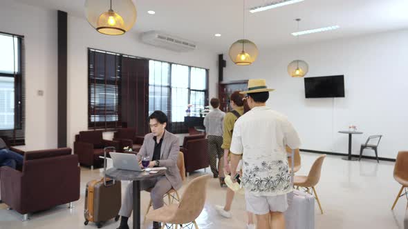 4K Group of People waiting for boarding time at airport private lounge