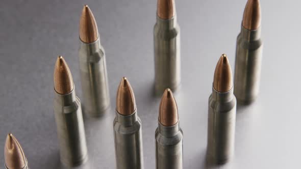 Cinematic rotating shot of bullets on a metallic surface - BULLETS 002
