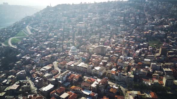 Drone view on poverty slum district and muslim mosque