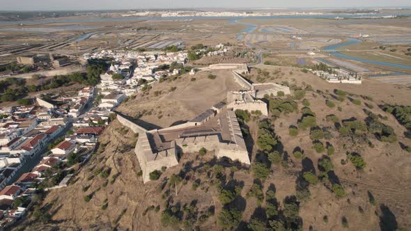 Aerial circular pan shot, Forte de Sao Sebastiao in old town of Castro Marim, Algarve, Portugal