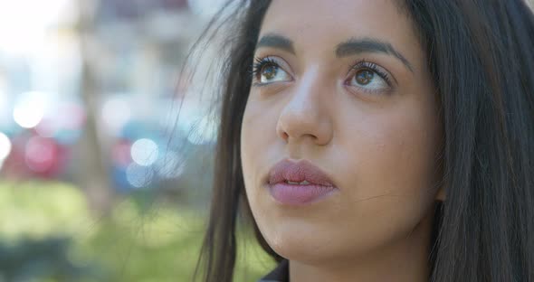 hope, faith- sad moroccan woman looks at the sky comforted