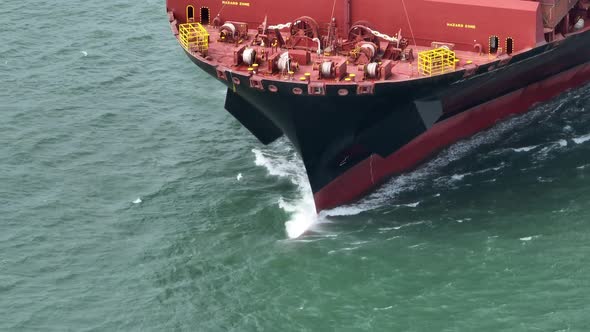 Container Ship Bow in the Ocean Aerial View