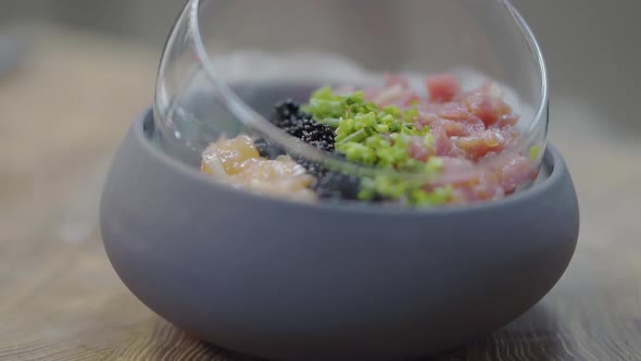 Amazing Tasty Dish with Tuna, Salmon Pieces, Blackberries, Greens and Dry Ice