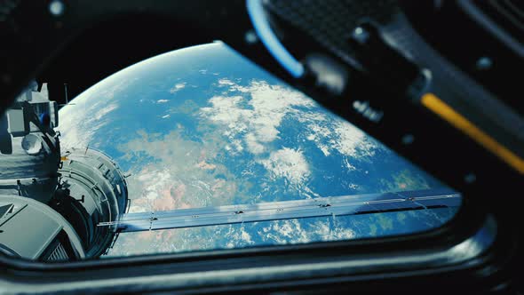 A View of the Earth Through the Big Quadrangle Porthole of a Space Station alt