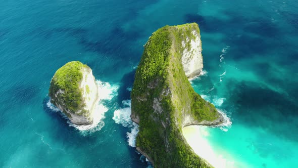 Beautifulbeach of Kelingking in Nusa Penid.  Aerial View of Big Blue Sea Wave Viewpoint.   Drone