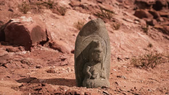 Ancient Statue on the Rocks Desert