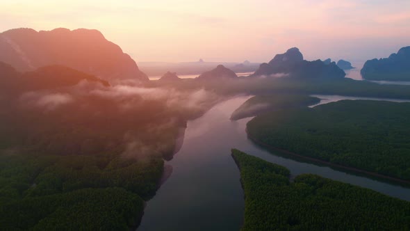 4K : Drone flying above the clouds, Limestone mountains with mangrove