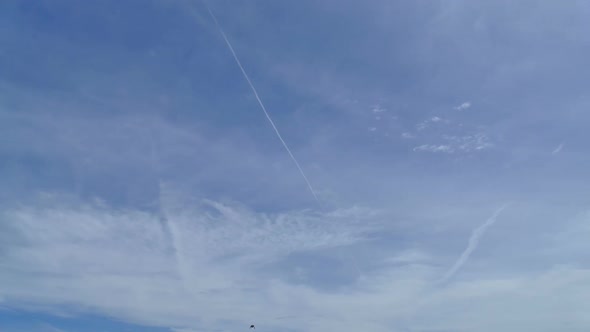 Time lapse of white cloud moving pass around sky background