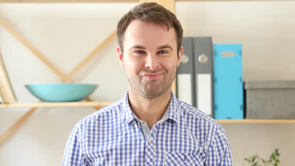 Yes By Man Shaking Head to Agree Sitting in Office