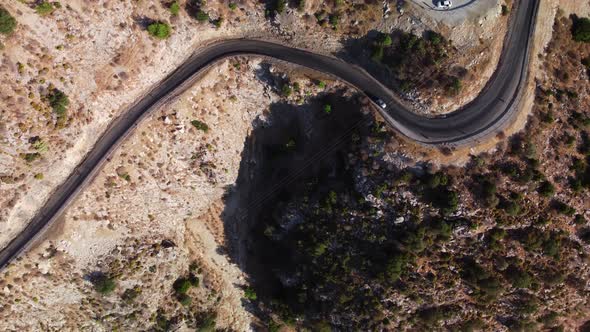 Aerial Footage of Winding Road in Turkish Mountains Filmed By Drone From Above at Hot Summer Day