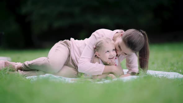 Family In Nature. Mother And DaughterHaving Fun At Park