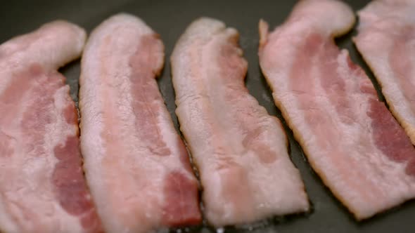 Bacon frying in pan, Slow Motion