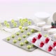 Multi-colored pills and capsules lie on the table. Scattered drugs. Cold and flu season - VideoHive Item for Sale