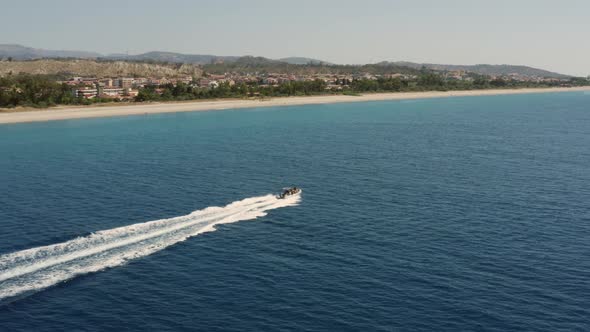 aerial view of motorboat wake in ocean