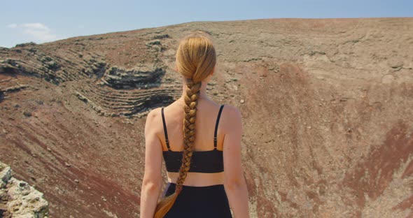 Adult Girl Tourist Enjoying View of Volcano Crater Montana Roja