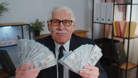 Business Man Accountant Celebrating Business Success Dancing with Stack of Money Dollar Cash