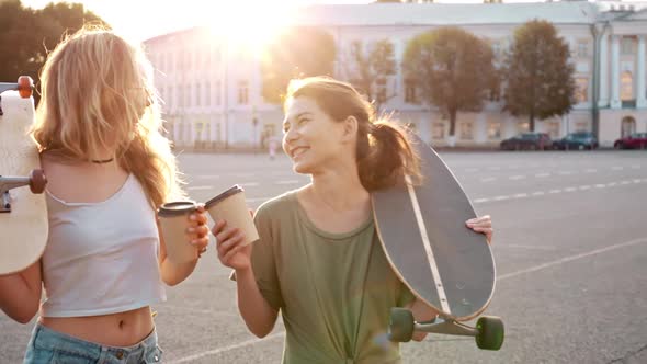 Two Fashion Hipster Girls at Outdoors Summer Party Pretty Teenage Friends with Skateboard in