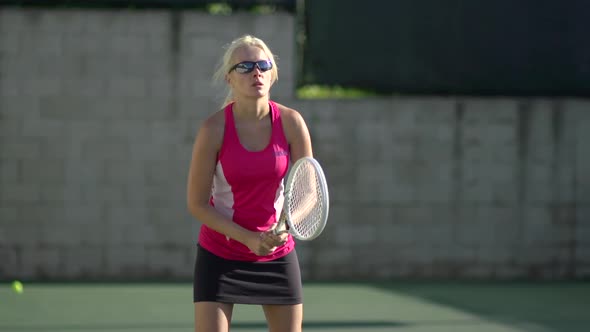 Women playing tennis.