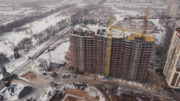 Building under construction in Winter with snow