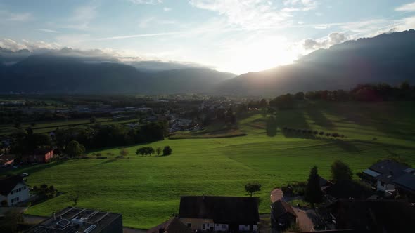 Aerial View of Liechtenstein with Houses on Green Fields in Alps Mountain Valley