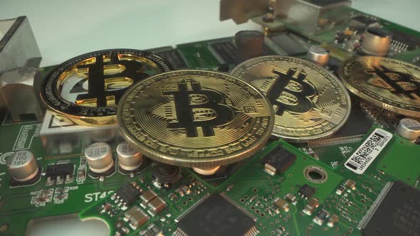 Many Bitcoins on the Electronic Chip. BTC Macro Shot. Blockchain Technology. Golden Bitcoins on a